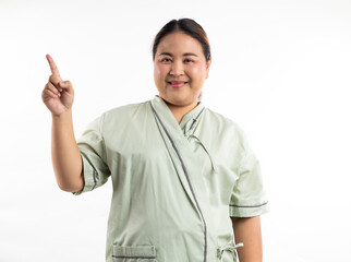Excite female patient pointing up and looking at camera. Happy winner smiling asian women patient on white background. Fat and overweight obese woman