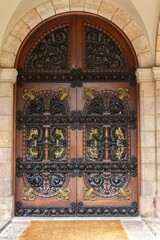 Fototapeta na wymiar Vertical shot of a historic old building door in the Ciutadella Park in Barcelona, Catalonia, Spain