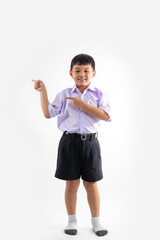 Excited wow fingle point up and side. Thai school uniform with backpack bag. Portrait Young Asian cute boy standing on white background banner. Back to school.