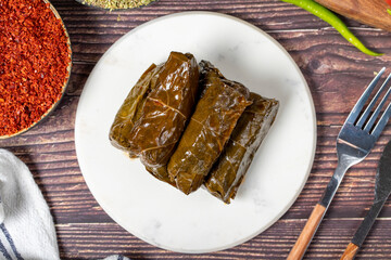 Olive oil leaf wrap. Aegean cuisine delicacies. Grape leaf wrap with rice stuffing. local name zeytinyagli yaprak sarma. Top view