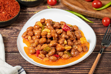 Kidney beans dish with olive oil on wood floor. Healthy foods. Aegean cuisine delicacies.