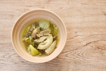 pickled Chinese cabbage with pork entrails and bone soup in bowl