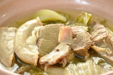 pickled Chinese cabbage with pork entrails and bone soup in bowl