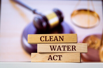 Wooden blocks with words 'Clean Water Act'. Legal concept