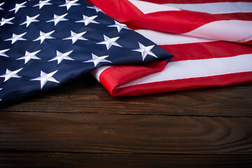 US flag on wooden background with copyspace