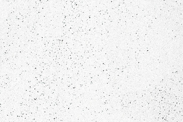 A texture of dust specks or speckles, black dots of varying sizes over a white surface, grunge background.
