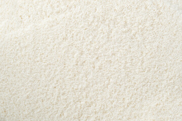 Full frame of fresh coconut flakes close up.