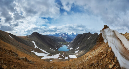 Hiking in the mountains. Rivers and mountain lakes, summer landscape of ridges and peaks. An amazing journey