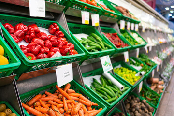 The counter with vegetables in the supermarket