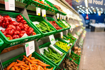 The counter with vegetables in the supermarket