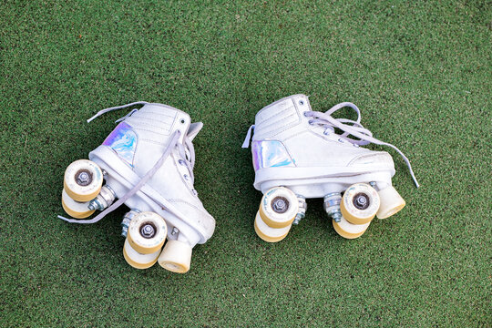 White roller skates on grass field