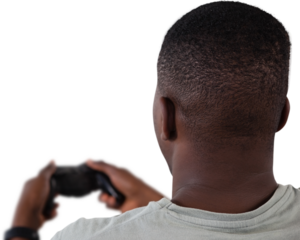 Man playing video game against white background