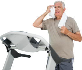 Tired senior man running on a treadmill