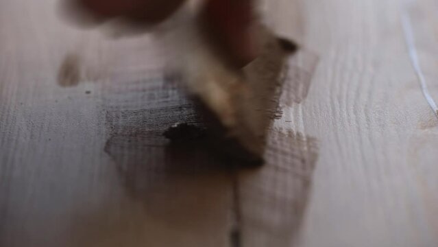 Macro shot of the floor tile grouting process. Cosmetic step in the tiling process.