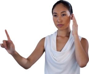 Serous businesswoman pretending to answer call while touching invisible interface