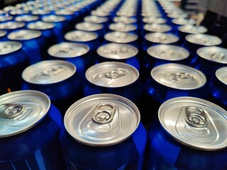Blue soda can lined at the factory