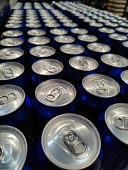 Blue soda can lined at the factory