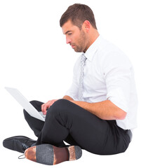 Businessman sitting on the floor using laptop 