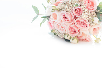 Beautiful bouquet of pink roses and ranunculus. stylish wedding attributes of bride. blooming flowers festive background, pastel and soft bouquet floral card