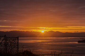 Sun Rising Behind East San Francisco Bay Area Mountains During Sunrise from Marin Headlands