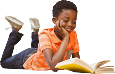 Cute boy reading book in library