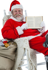 Happy Santa Claus showing Bible