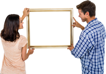Happy couple holding picture frame
