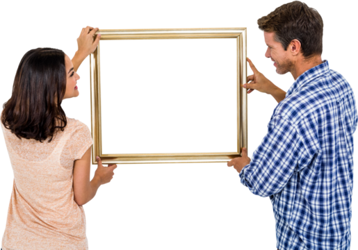 Happy couple holding picture frame - Powered by Adobe