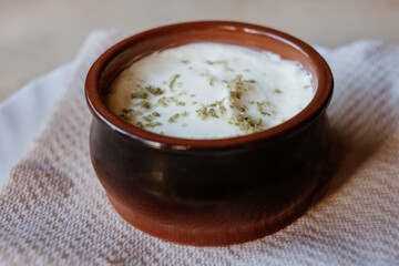 Andean potato cake fresh from the oven prepared with cheese, potato eggs and milk, in a circular metal container that is on a wooden surface