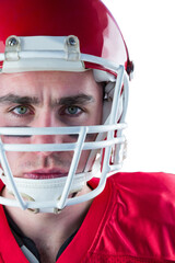 Portrait of a serious american football player taking his helmet looking at camera