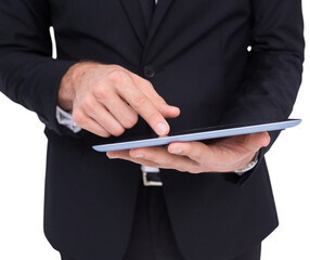 Mid section of a businessman touching digital tablet