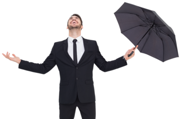 Happy businessman holding umbrella