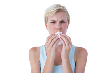 Portrait of attractive woman blowing her nose