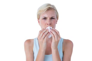 Portrait of attractive woman blowing her nose