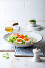 Cottage cheese with smoked salmon, cucumber, soft boiled egg and fresh chives. Savory hight protein breakfast bowl.