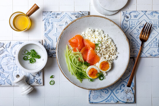 Cottage cheese with smoked salmon, cucumber, soft boiled egg and fresh chives. Savory hight protein breakfast bowl.