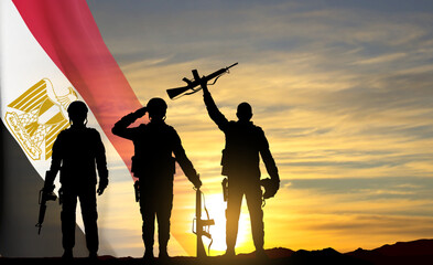 Fototapeta na wymiar Silhouettes of soldiers against the sunset with Egypt flag. Background for National Holidays. Concept - Armed Forces. EPS10 vector