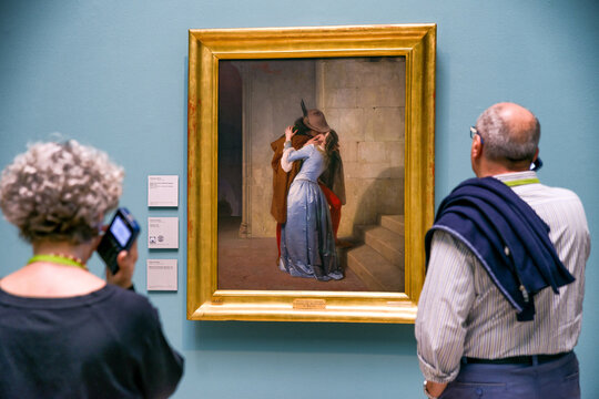 Visitors viewing Hayez&rsquo;s painting The Kiss in the Brera Art Gallery in Milan during cultural exhibition