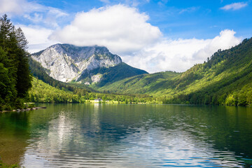 Naklejka na ściany i meble Beautiful view of a lake surrounded with mountains