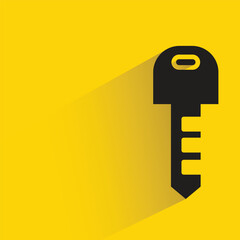 door key with shadow on yellow background