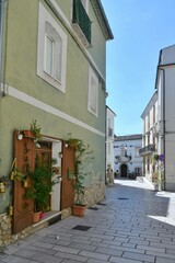 A narrow street among the old houses of Larino, a medieval town in the province of Campobasso in Italy.