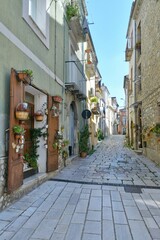A narrow street among the old houses of Larino, a medieval town in the province of Campobasso in Italy.