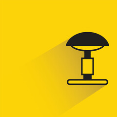 bedside lamp with shadow on yellow background