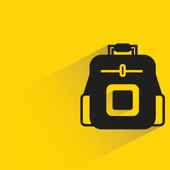 backpack with shadow on yellow background