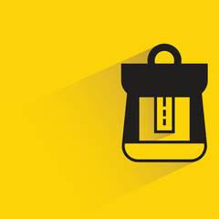 backpack with shadow on yellow background