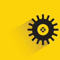 gear with shadow on yellow background