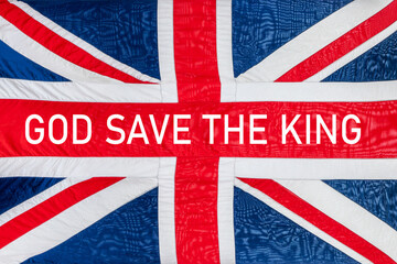 God saves the king written a british UK flag, Union Jack background, king coronation celebration - obrazy, fototapety, plakaty