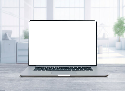 blank screen of laptop on wood top table