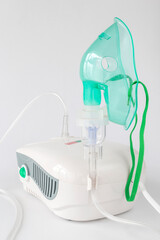 Medical equipment for inhalation with a respiratory mask nebulizer on a white background