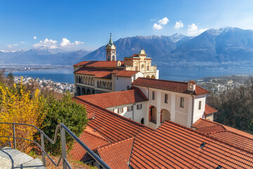 Early spring in Locarno, Ticino, Switzerland. View to Madonna del Sasso church and Lago Maggiore. - 592323296